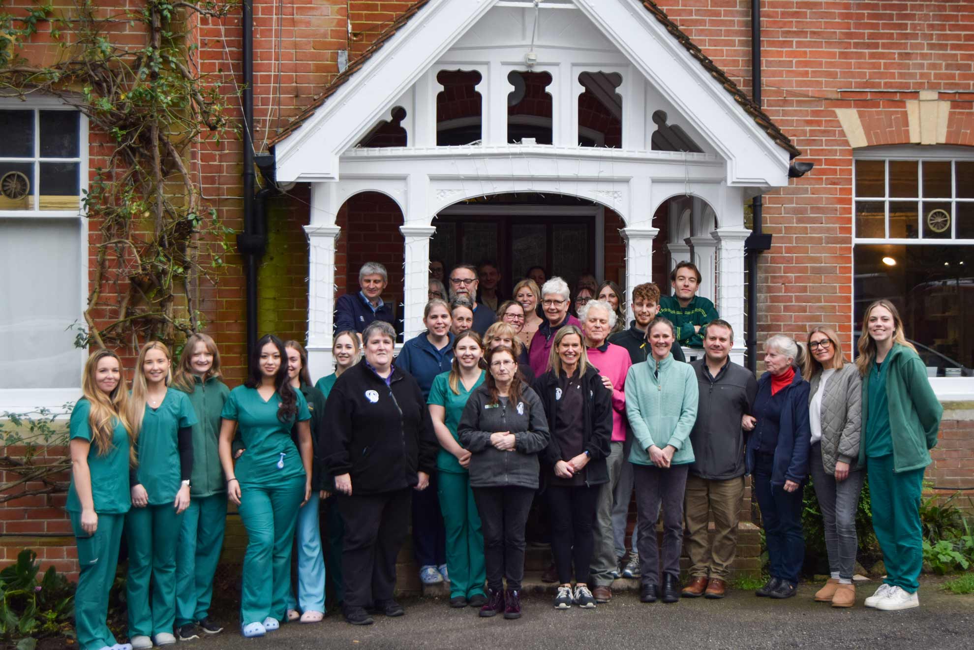 oathall veterinary team stood together in front of veterinary practice building