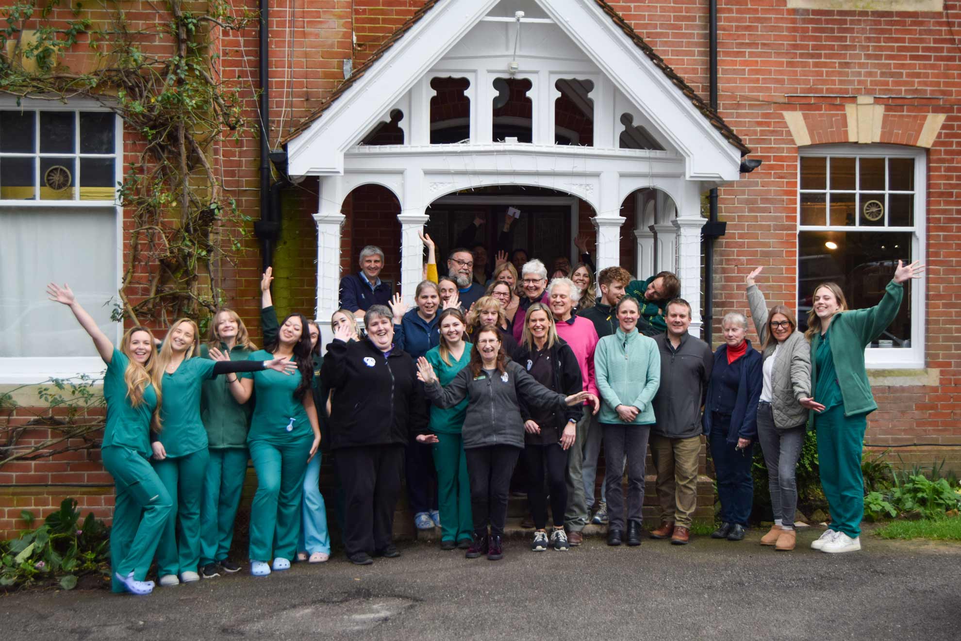 oathall veterinary team stood together in front of veterinary practice building